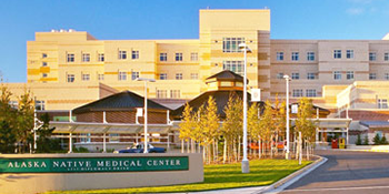 Exterior view of Alaska Native Medical Center with campus entrance sign.